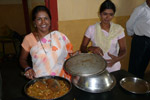 Usha & Lalita serving a meal